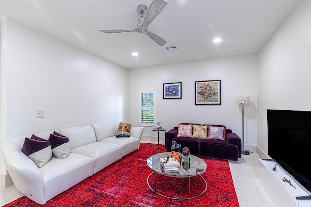 living room featuring ceiling fan, visible vents, baseboards, and recessed lighting