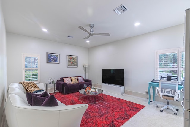 living room featuring a wealth of natural light, recessed lighting, visible vents, and ceiling fan