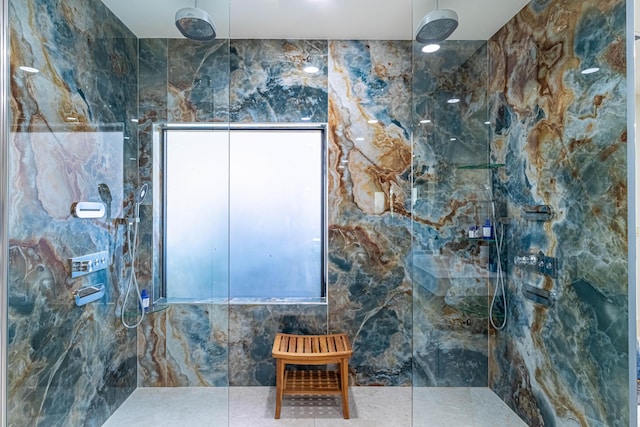 bathroom with a marble finish shower