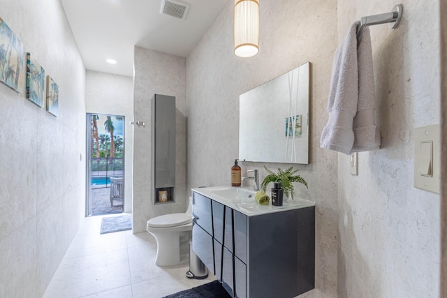 full bathroom with tile patterned flooring, visible vents, vanity, and toilet