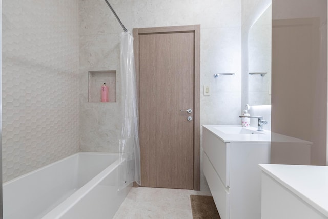 bathroom with shower / bath combo with shower curtain and vanity