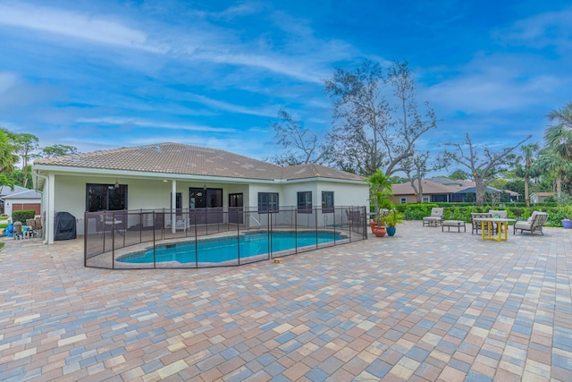 view of pool featuring fence, a fenced in pool, and a patio