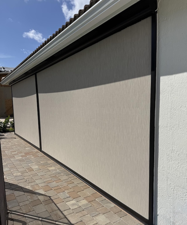 view of property exterior with a patio area and stucco siding