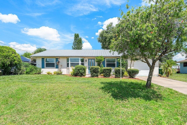 ranch-style home with a garage and a front yard