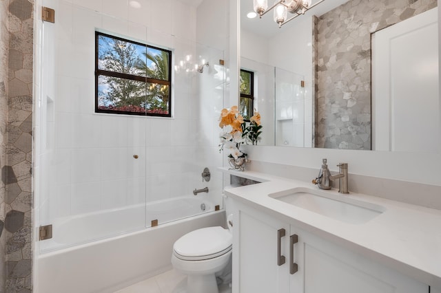 full bathroom with tile patterned flooring, an inviting chandelier, toilet, vanity, and bath / shower combo with glass door