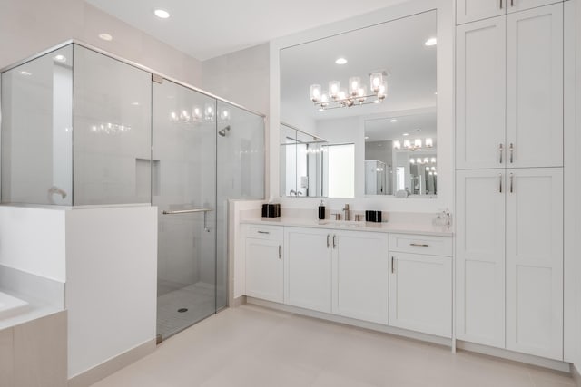 bathroom featuring vanity and a shower with door