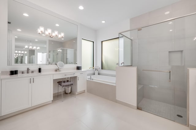 bathroom featuring separate shower and tub, vanity, and tile patterned flooring