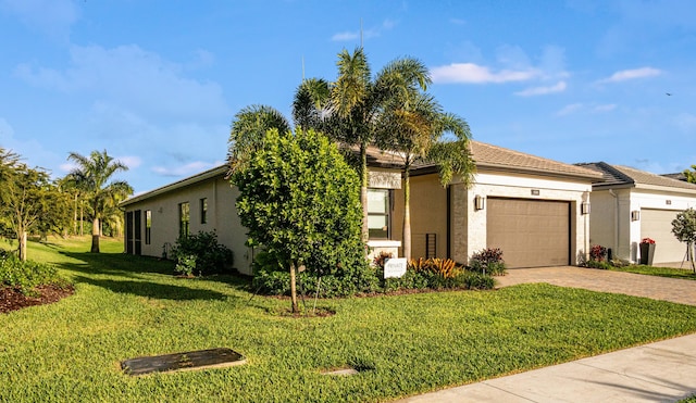 view of front facade with a front yard and a garage