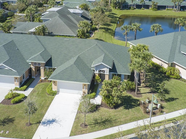 birds eye view of property featuring a water view