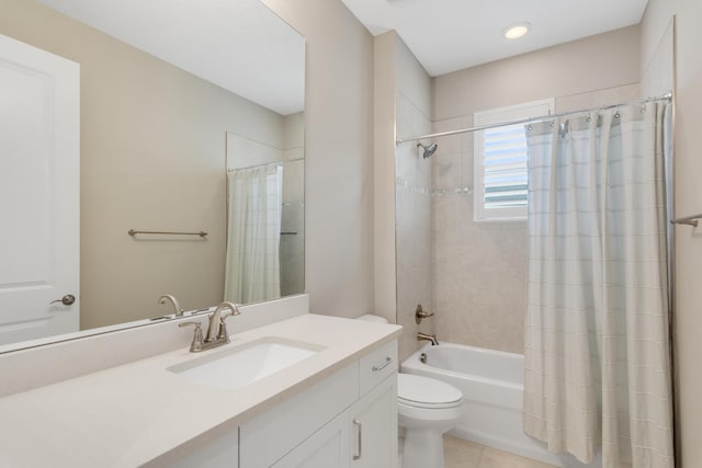 bathroom featuring tile patterned floors, vanity, toilet, and shower / bath combo with shower curtain