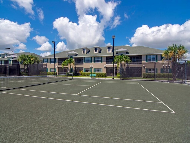 view of sport court featuring fence