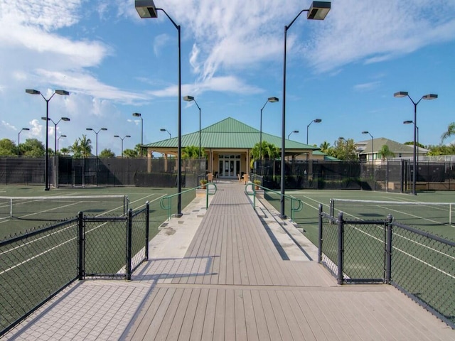 view of tennis court with fence