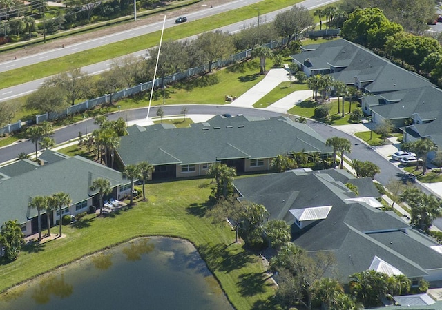 bird's eye view with a water view and a residential view