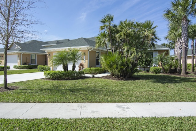 view of property hidden behind natural elements with concrete driveway, a front lawn, an attached garage, and stucco siding