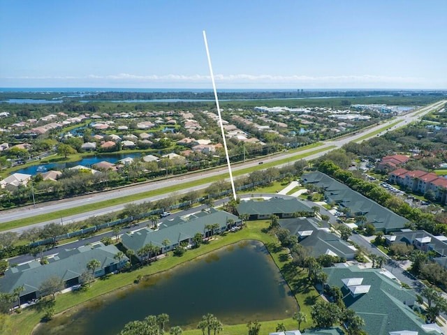 aerial view featuring a residential view and a water view