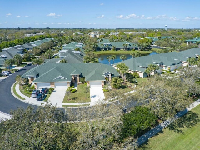 aerial view featuring a residential view and a water view