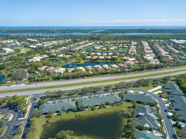 bird's eye view with a residential view and a water view