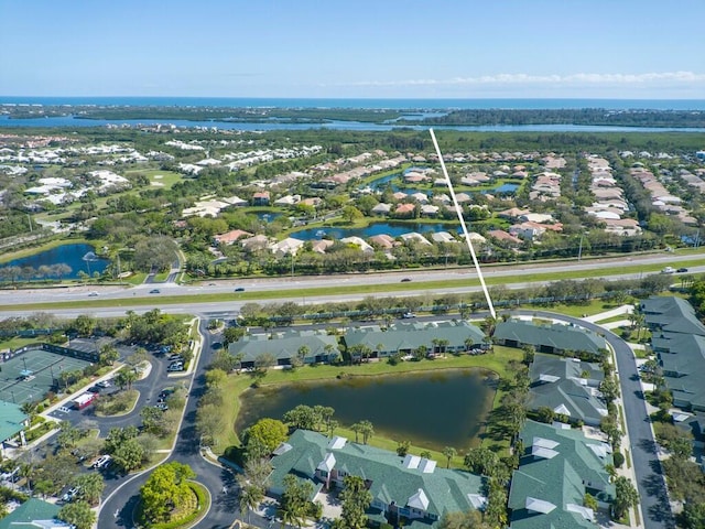 birds eye view of property featuring a residential view and a water view