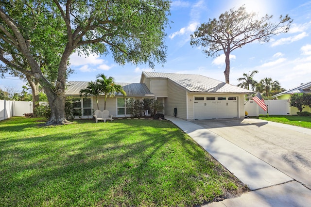 ranch-style home with a front yard and a garage