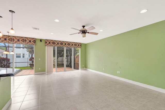 unfurnished room with recessed lighting, visible vents, ceiling fan, and baseboards