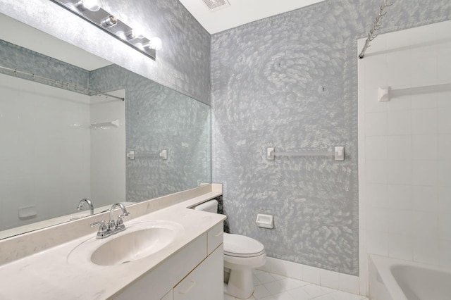 bathroom featuring tile patterned flooring, toilet, vanity, baseboards, and wallpapered walls