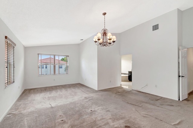 spare room featuring a notable chandelier, light carpet, visible vents, baseboards, and vaulted ceiling