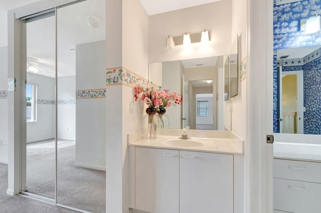 bathroom featuring vanity and baseboards