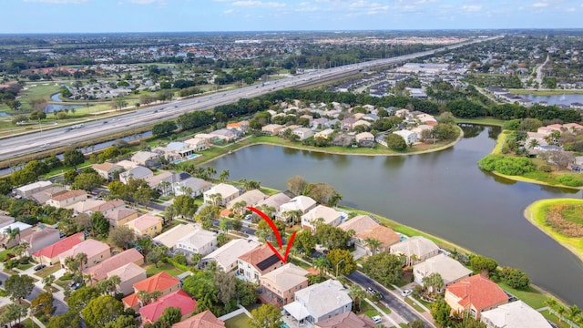 bird's eye view featuring a residential view and a water view