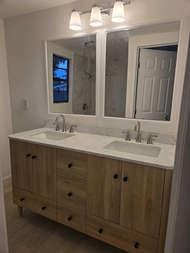 bathroom with vanity and wood-type flooring