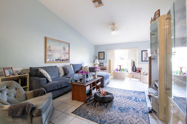 living room with high vaulted ceiling, visible vents, and light tile patterned flooring