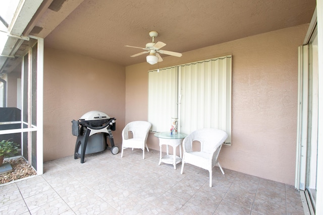 view of patio / terrace with ceiling fan and a grill