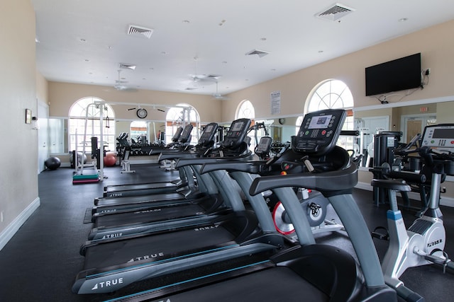 workout area featuring baseboards and visible vents