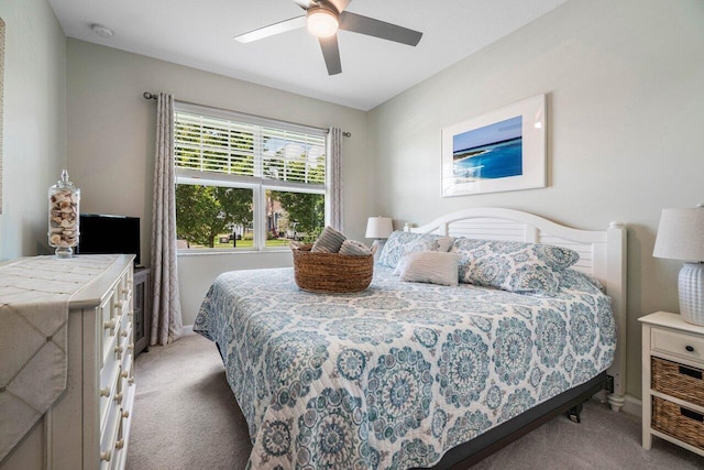 bedroom with light colored carpet and ceiling fan