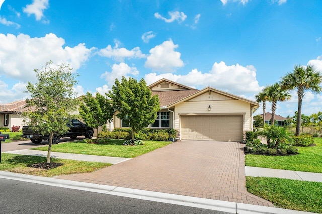 view of front of home with a garage and a front yard