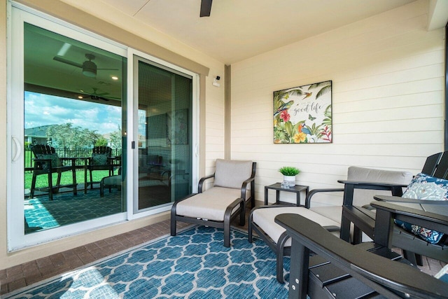 view of patio featuring ceiling fan