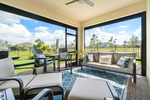 sunroom / solarium with ceiling fan