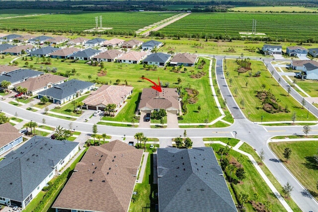 birds eye view of property with a rural view