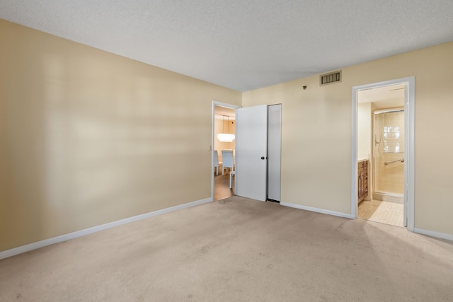 4640 Lucerne Lakes Blvd Unit 306, Lake Worth, FL 33467 - unfurnished bedroom with light carpet, baseboards, connected bathroom, and a closet