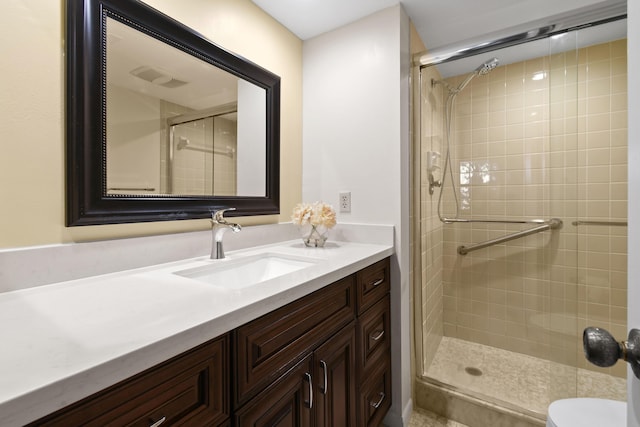 4640 Lucerne Lakes Blvd Unit 306, Lake Worth, FL 33467 - bathroom featuring a stall shower, vanity, and toilet