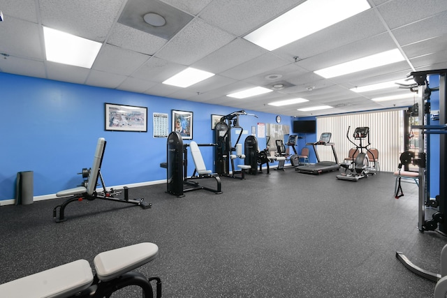 4640 Lucerne Lakes Blvd Unit 306, Lake Worth, FL 33467 - gym featuring a paneled ceiling and baseboards