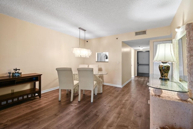 4640 Lucerne Lakes Blvd Unit 306, Lake Worth, FL 33467 - dining area featuring dark wood-type flooring, a textured ceiling, and baseboards
