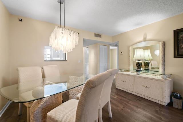 4640 Lucerne Lakes Blvd Unit 306, Lake Worth, FL 33467 - dining space with a chandelier, dark wood-style floors, and a textured ceiling