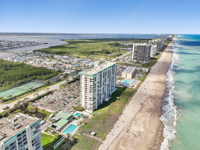 aerial view with a water view and a view of the beach