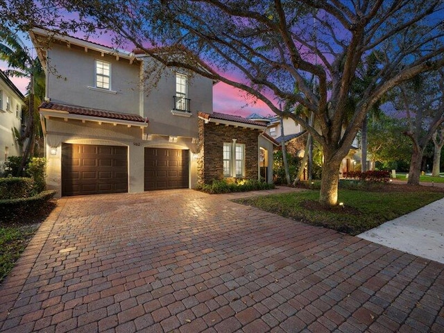 mediterranean / spanish house with a garage