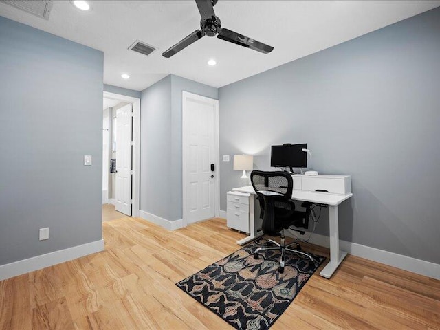 office area with ceiling fan and light hardwood / wood-style floors