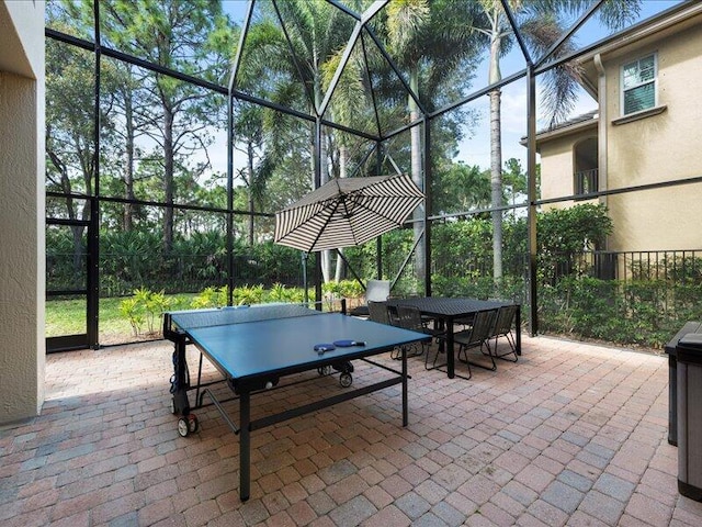 view of patio / terrace featuring glass enclosure