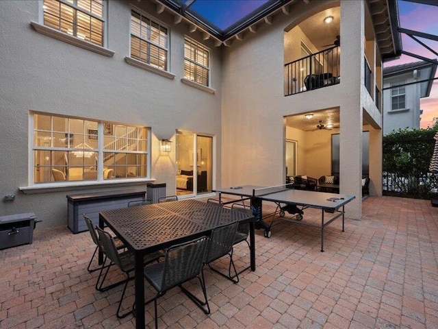 patio terrace at dusk with a balcony