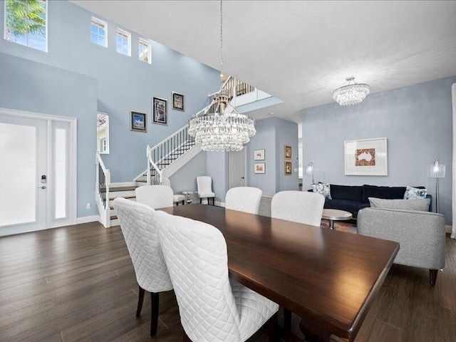 dining room featuring dark hardwood / wood-style flooring and a notable chandelier