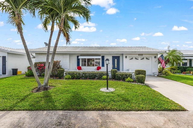 single story home with a front yard and a garage