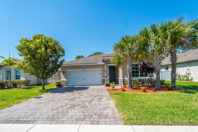 view of front of property featuring a front lawn, stucco siding, decorative driveway, a garage, and stone siding